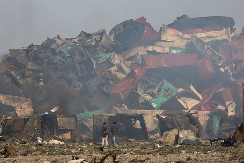 Illustration for article titled Photos from the aftermath of the devastating Tianjin explosion